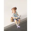 Сувенир полистоун Малышка в сарафане с книгой с сумкой-портфелем 9х75х145 см 10583345