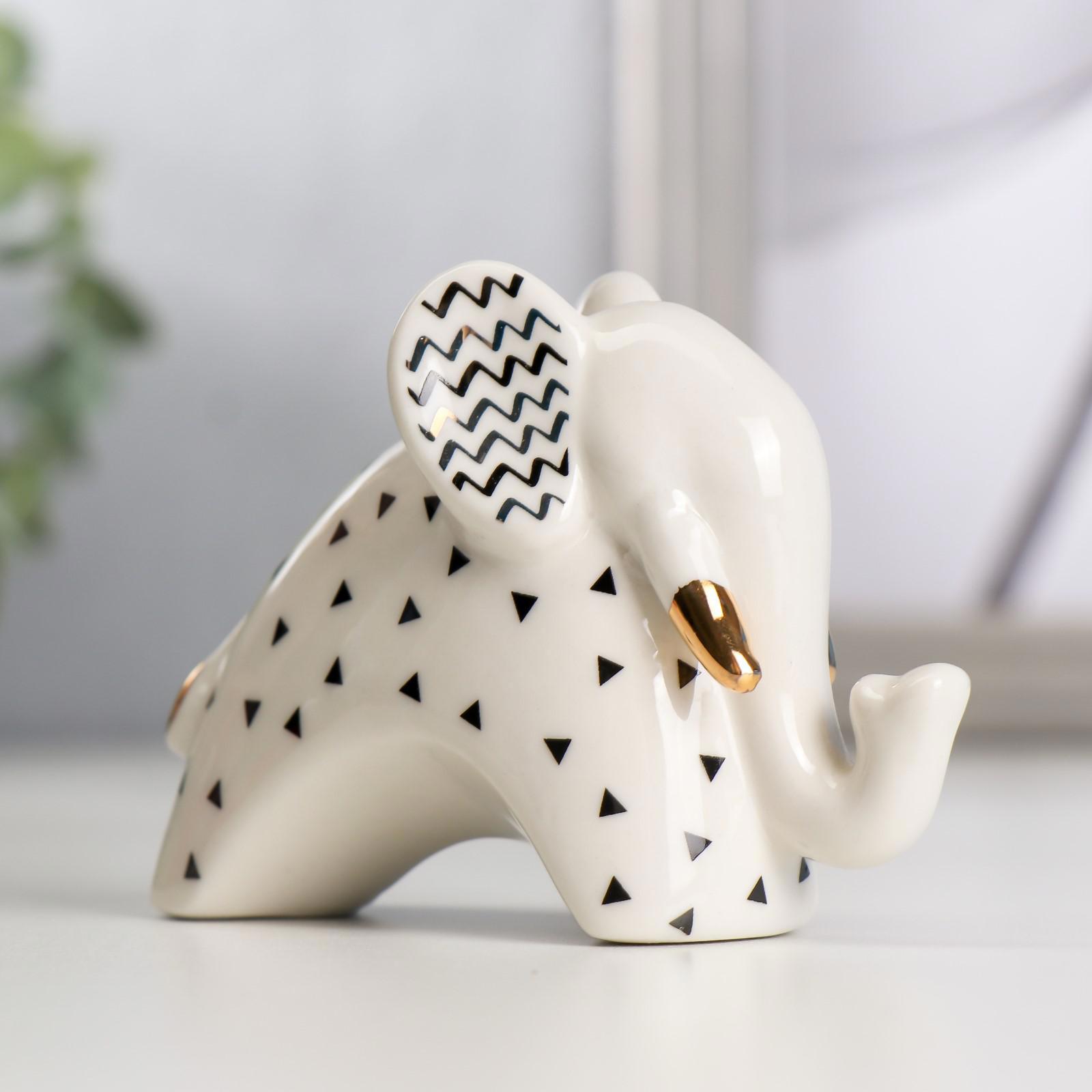 Изображение товара Фигурка Слонёнок с зигзагом на ушках бело-чёрный с золотом 7x4.2x9.8 см