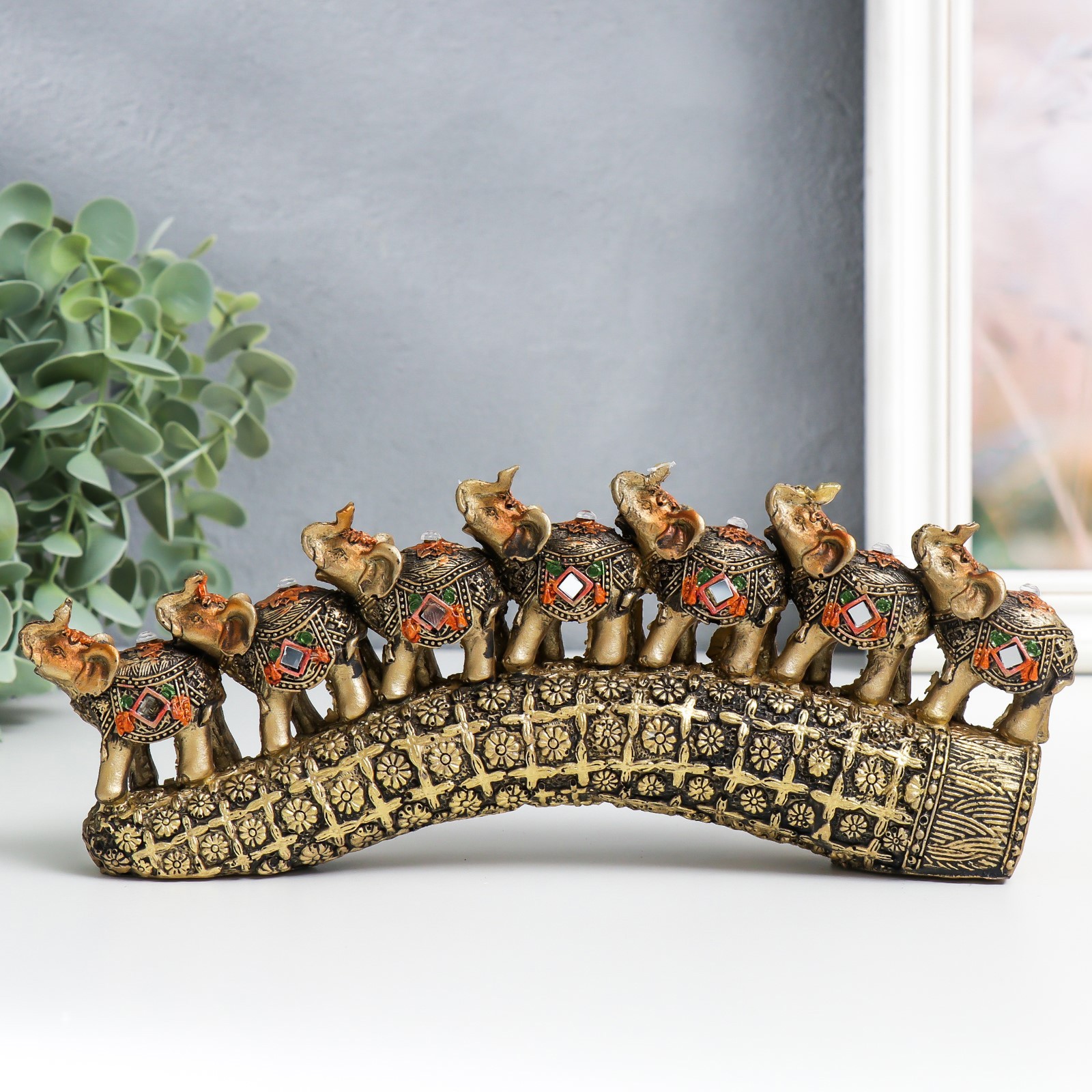 Изображение товара Семь слонов на бивне с цветами — декоративная фигура бронза, 21x4x9.8 см