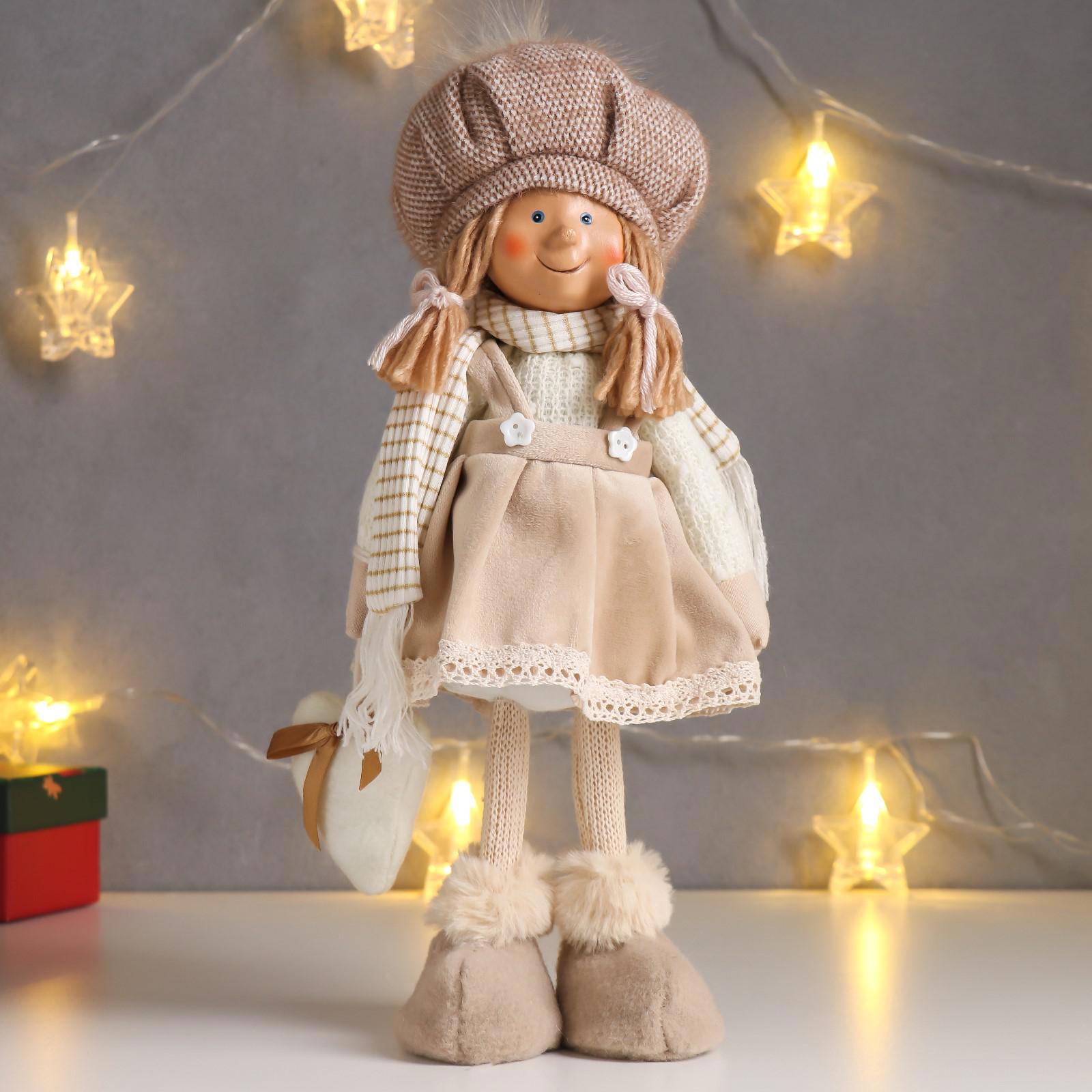Изображение товара Кукла интерьерная "Малышка с хвостиками, бежевый сарафан и шапка, с сердцем" 36 см