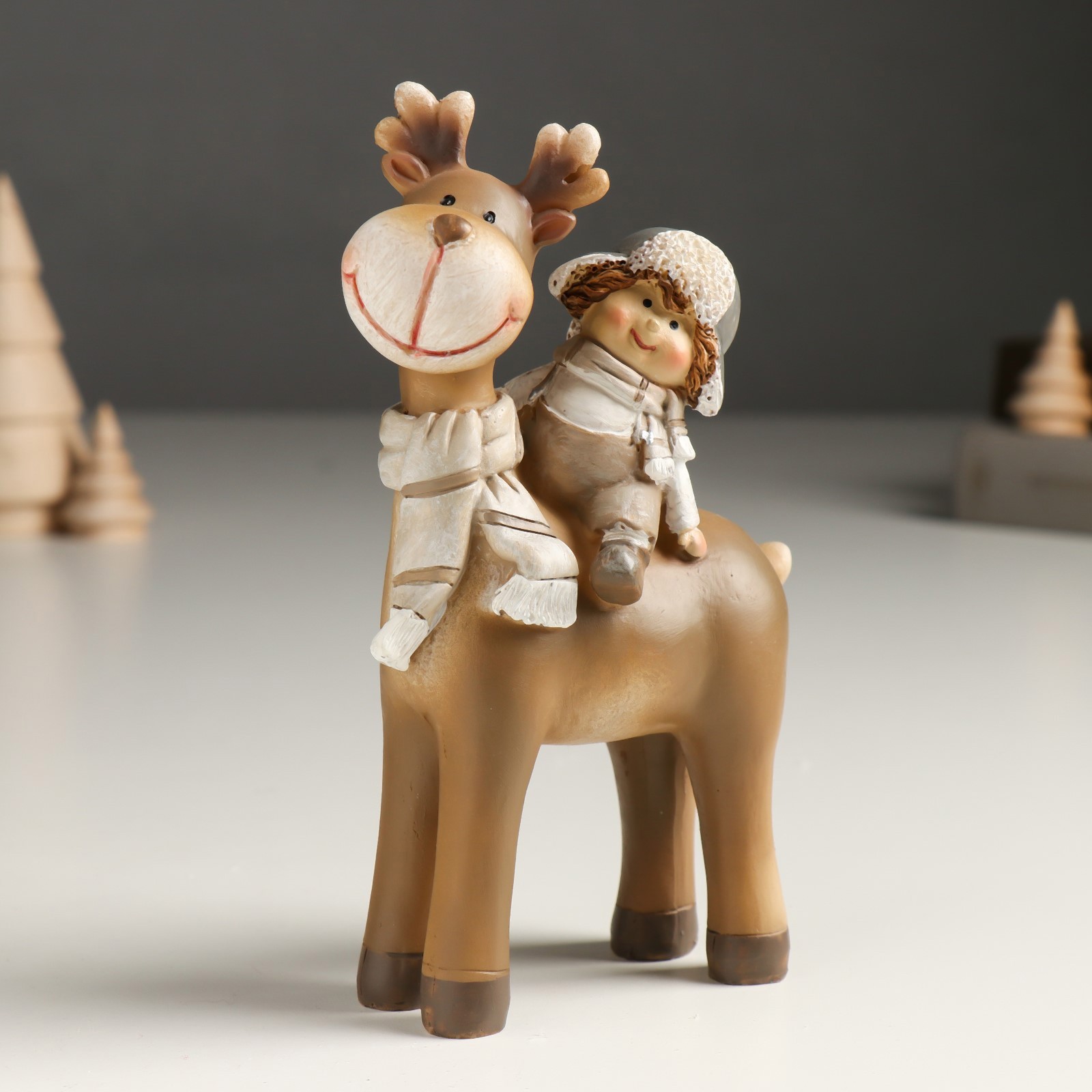 Изображение товара Сувенир "Малыш в шапке-ушанке верхом на лосике" беж 6x11x14 см