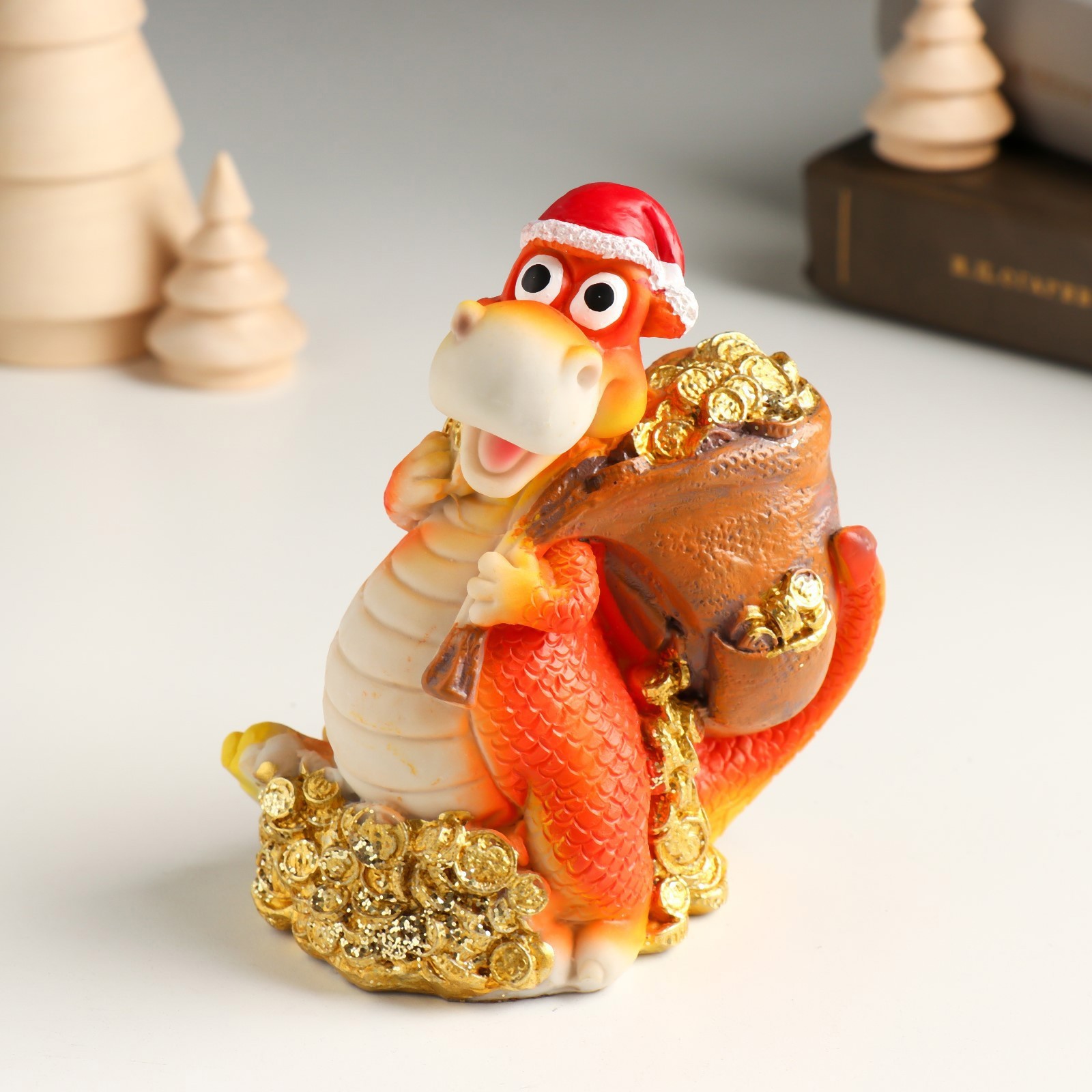 Изображение товара Копилка "Дракон в новогоднем колпаке с мешком монет" 9.5x6.1x11 см