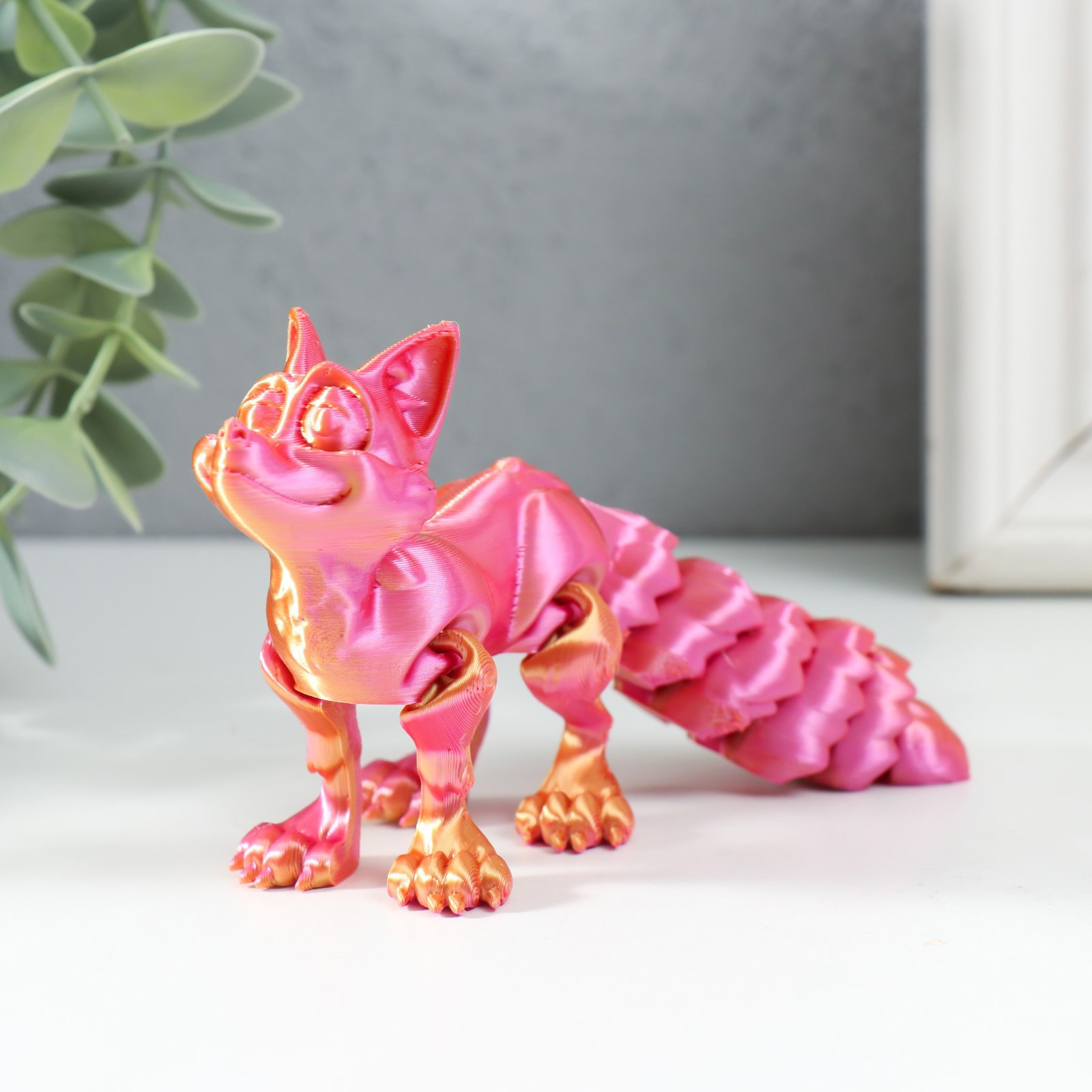 Изображение товара Сувенир-антистресс "Лис Ник" 14x4x7.5 см розовый хамелеон