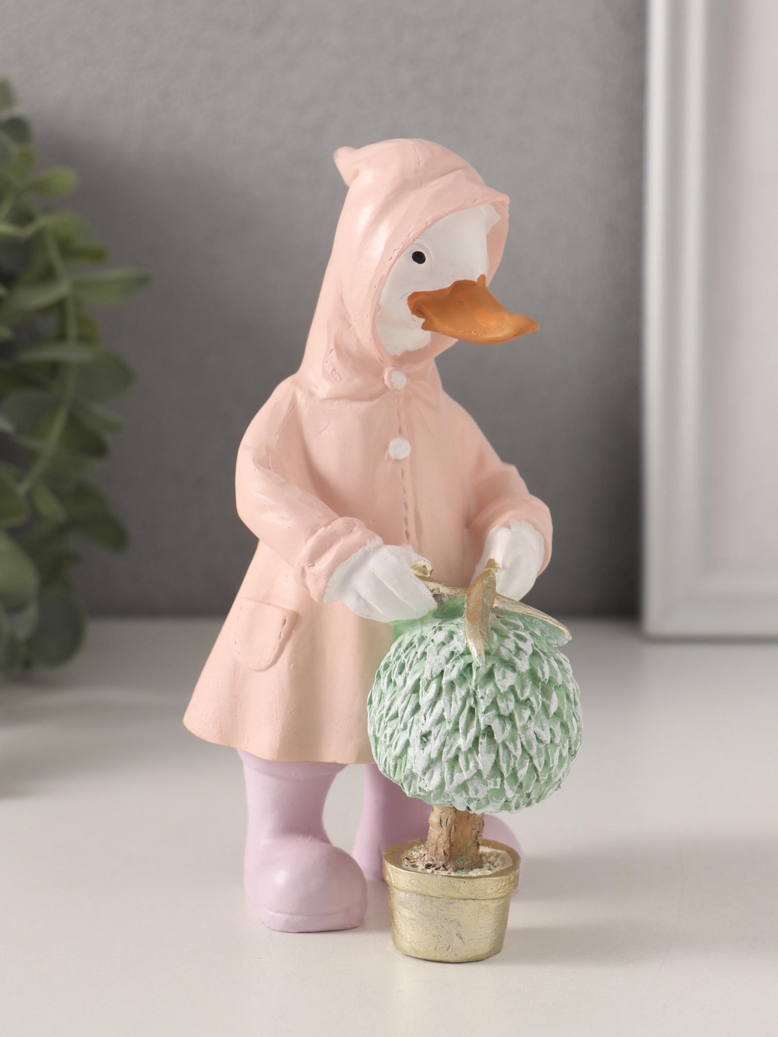 Изображение товара Сувенир полистоун Утка в дождевике стрижёт цветок 9х65х145 см 10583265