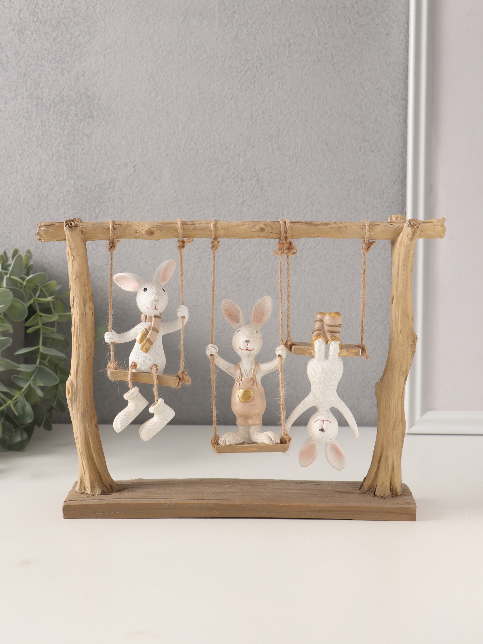Изображение товара Сувенир полистоун Зайчата - три друга на качелях белый с золотом 26х55х20 см 10740319