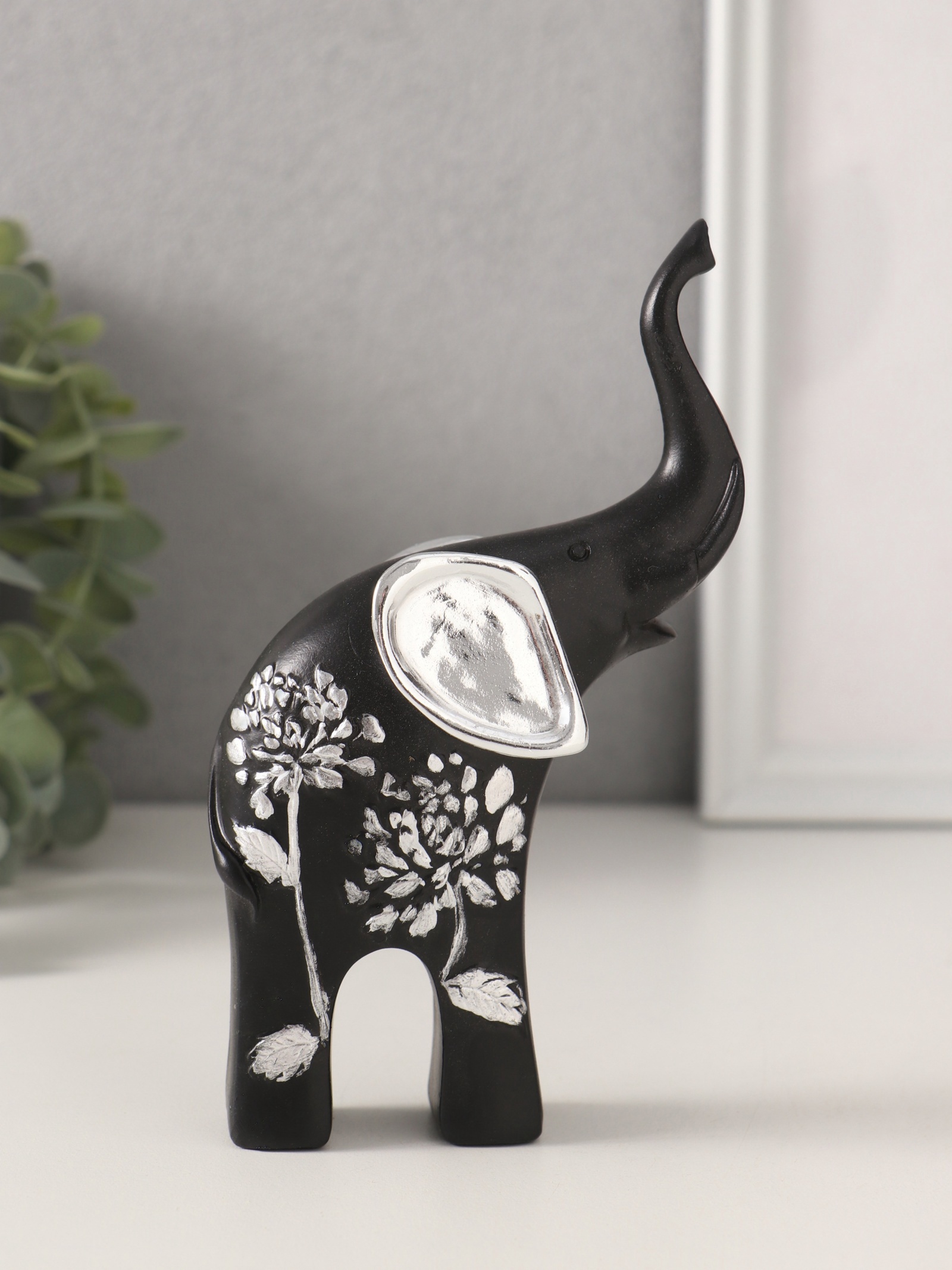 Изображение товара Сувенир полистоун Чёрный слон с серебр. ушками хобот вверх серебряный цветок 9х45х155 см 10740